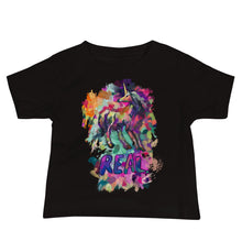 Load image into Gallery viewer, A black, jersey-style tee for babies from Real Unicorn Apparel&#39;s &quot;Real Unicorn&quot; collection. The t-shirt features a magical unicorn from world mythology and the word &quot;Real&quot; under its hooves.
