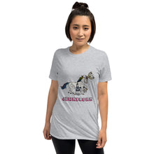 Load image into Gallery viewer, An attractive model in her twenties wearing a grey t-shirt from Real Unicorn Apparel. The t-shirt shows a horse with a menorah on its forehead and other religious symbols of Judaism. Underneath is the word &quot;Jewnicorn,&quot; short for Jewish unicorn.
