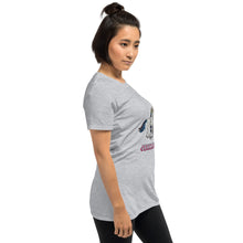 Load image into Gallery viewer, A side profile photograph of a young woman wearing Real Unicorn Apparel&#39;s Jewnicorn t-shirt. 
