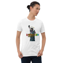 Load image into Gallery viewer, This is a photograph of a handsome man wearing a white t-shirt with a comical, cartoon-style drawing of a unicorn as the Statue of Liberty. The shirt is from Real Unicorn Apparel&#39;s &quot;uNYCorn&quot; collection.
