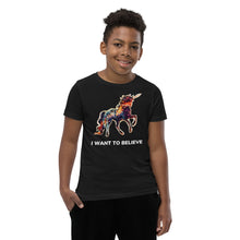 Load image into Gallery viewer, An African-American boy wearing an &quot;I Want To Believe&quot; (in unicorns) t-shirt from Real Unicorn Apparel.

