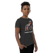 Load image into Gallery viewer, A dark grey &quot;I Want To Believe&quot; Youth Short Sleeve T-Shirt with a rainbow-colored unicorn on it that&#39;s made by Real Unicorn Apparel.
