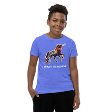 Load image into Gallery viewer, A boy flashes a smile as he wears an &quot;I Want To Believe&quot; In Unicorns t-shirt made by Real Unicorn Apparel.
