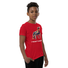 Load image into Gallery viewer, An &quot;I Want to Believe&quot; t-shirt from Real Unicorn Apparel being worn by an African-American middle-school age boy. 
