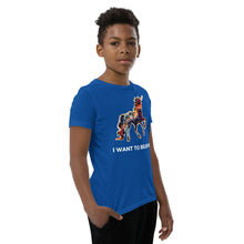 Load image into Gallery viewer, An African-American middle school boy modeling an &quot;I Want To Believe In Unicorns&quot; t-shirt from Real Unicorn Apparel.
