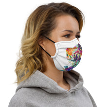 Load image into Gallery viewer, A shot of a woman in profile wearing a white face mask with a colorful unicorn on it. The mask is from Real Unicorn Apparel. 
