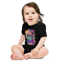 Load image into Gallery viewer, A black one-piece shirt with a majestic, mythical unicorn in a rainbow of colors with the word &quot;REAL&quot; in large, purple letters. It is from Real Unicorn Apparel and is for babies.
