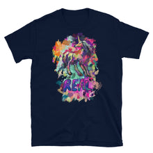 Load image into Gallery viewer, A navy tee from Real Unicorn Apparel featuring a depiction of a unicorn drawn by artist Lauren Rubin and the word &quot;Real&quot; in big, bold, purple letters.
