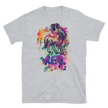 Load image into Gallery viewer, A grey t-shirt from the &quot;Real Unicorn&quot; clothing line put out by quirky fashion brand Real Unicorn Apparel. There&#39;s a depiction of a magical, mythical unicorn from global folklore with the word &quot;REAL&quot; underneath the unicorn.
