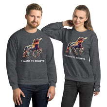 Load image into Gallery viewer, A playful and attractive couple wearing &quot;I Want To Believe&quot; sweatshirts of a rainbow-colored unicorn from Real Unicorn Apparel.
