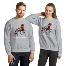 Load image into Gallery viewer, A young couple in their twenties wearing two grey sweatshirts with unicorn symbolism from Real Unicorn Apparel&#39;s &quot;I Want To Believe&quot; collection.
