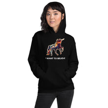 Load image into Gallery viewer, A female model who is decked out in a black &quot;I Want To Believe&quot; (in Unicorns) hoodie from Real Unicorn Apparel. 
