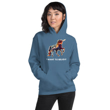 Load image into Gallery viewer, An indigo blue hoodie with a multi-colored unicorn and the phrase &quot;I Want To Believe&quot; placed underneath the magical creature. 
