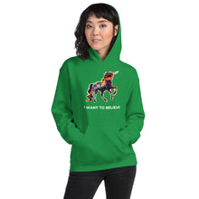 Load image into Gallery viewer, A hip-looking young woman in her twenties wearing an Irish green I Want To Believe (In Unicorns) hoodie from Real Unicorn Apparel with the hood partially pulled up.
