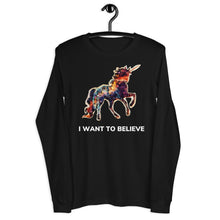 Load image into Gallery viewer, A black, long-sleeve t-shirt from Real Unicorn Apparel&#39;s &quot;I Want To Believe&quot; collection on a black clothes hanger. The t-shirt features a rainbow-colored unicorn.
