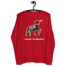 Load image into Gallery viewer, A red, long-sleeve, unisex t-shirt from Real Unicorn Apparel with a majestic, multicolored unicorn. Underneath the unicorn is the text &quot;I Want To Believe.&quot;

