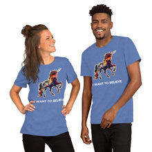 Load image into Gallery viewer, A white woman and an African-American man wearing heather true royal-colored shirts from Real Unicorn Apparel. The shirts feature the slogan &quot;I Want To Believe&quot; and a rainbow-colored unicorn with a large horn.
