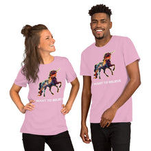 Load image into Gallery viewer, A hip, modern, attractive interracial couple wearing lilac-colored  &quot;I Want To Believe&quot; t-shirts from Real Unicorn Apparel. The shirts feature a unicorn in a mosaic of colors.
