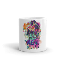 Load image into Gallery viewer, Real Unicorn Apparel&#39;s 11 oz. coffee mug of a magical, mythical unicorn with the word &quot;REAL&quot; below the animal.
